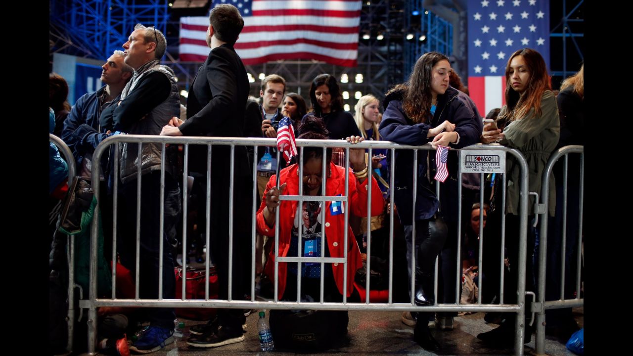 Marta Lunez prays at the Javits Center.