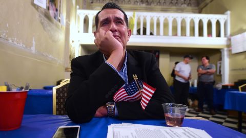 An emotional Gerardo Ruiz watches the election results from Clinton's headquarters in east Los Angeles.