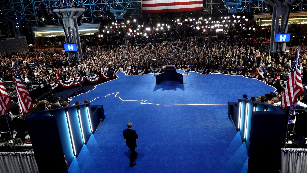 Clinton's campaign chairman, John Podesta, takes the stage to speak at the Javits Center. He told the crowd that Clinton would not be speaking. At the time, Clinton was behind in the Electoral College with several states still too close to call. She later conceded in a phone call to Trump.