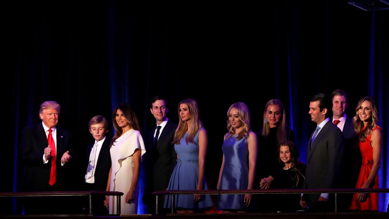 Trump, on stage with his family, acknowledges the crowd at the New York Hilton Midtown Hotel. He was gracious toward his opponent, Hillary Clinton, and called for unity. "We owe (Clinton) a very major debt of gratitude to her for her service to our country," Trump said. "I say it is time for us to come together as one united people."