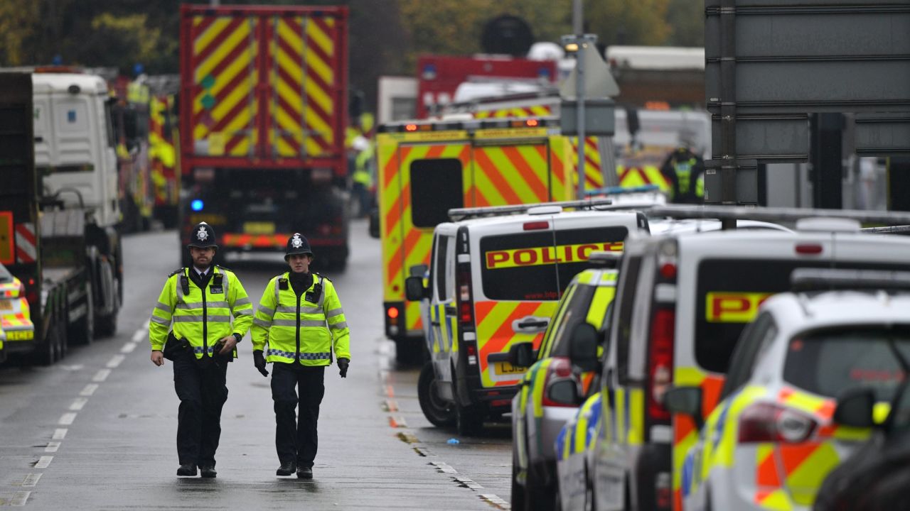 Police officers seen near the site of a tram derailment in Croydon on Wednesday.