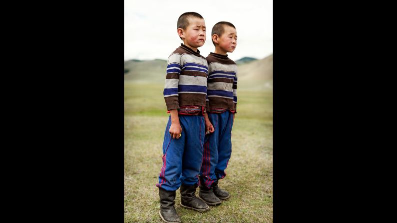 "These twins and their mom basically appeared in the middle of nowhere, when my vehicle broke down on the way to the Siberian border. Sometimes the opportunities to photograph just come to us."