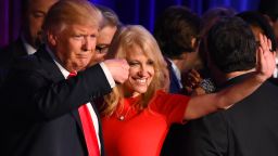 Republican presidential candidate Donald Trump falnked by campaign manager Kellyanne Conway waves to supporters following an address during election night at the New York Hilton Midtown in New York on November 9, 2016.