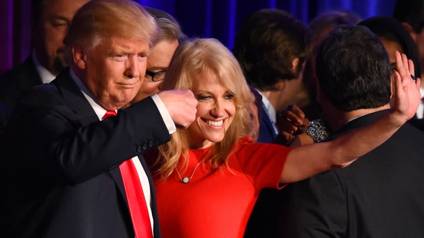 Republican presidential candidate Donald Trump falnked by campaign manager Kellyanne Conway waves to supporters following an address during election night at the New York Hilton Midtown in New York on November 9, 2016.