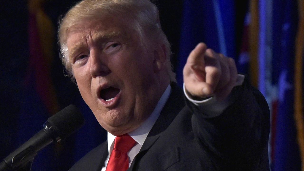 Republican presidential elect Donald Trump (L) gives a speech during election night at the New York Hilton Midtown in New York on November 9, 2016. 
Trump stunned America and the world Wednesday, riding a wave of populist resentment to defeat Hillary Clinton in the race to become the 45th president of the United States. / AFP / MANDEL NGAN        (Photo credit should read MANDEL NGAN/AFP/Getty Images)