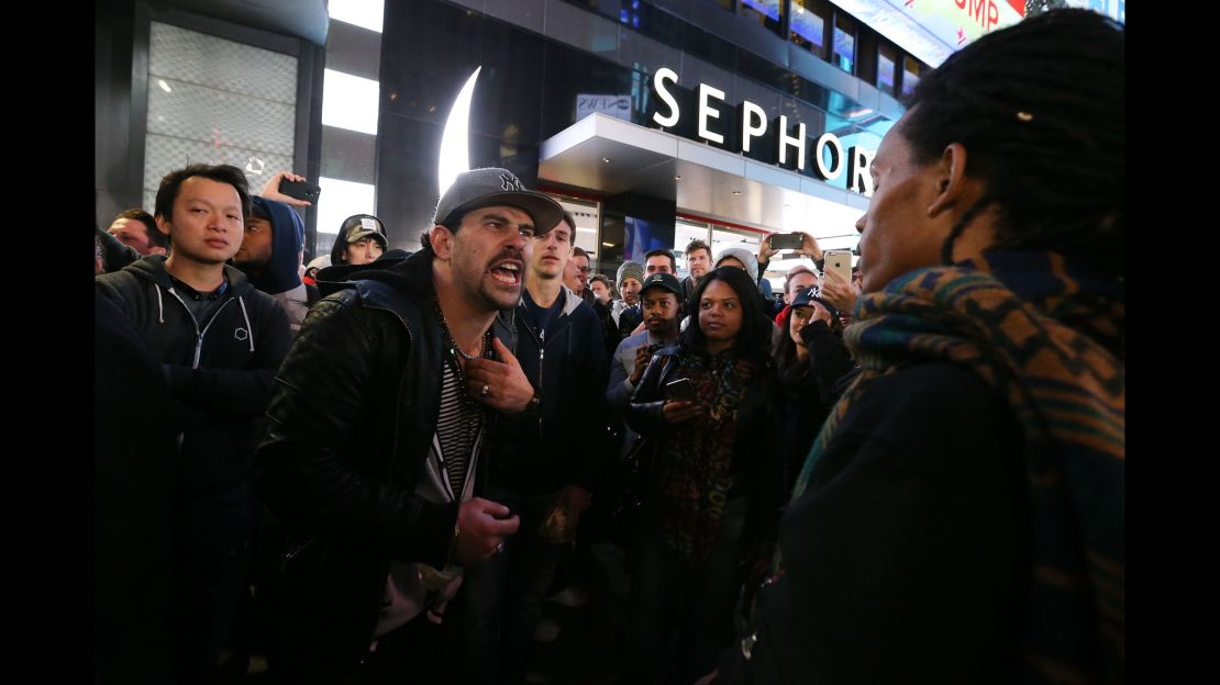 Trump and Clinton supporters argue outside Times Square