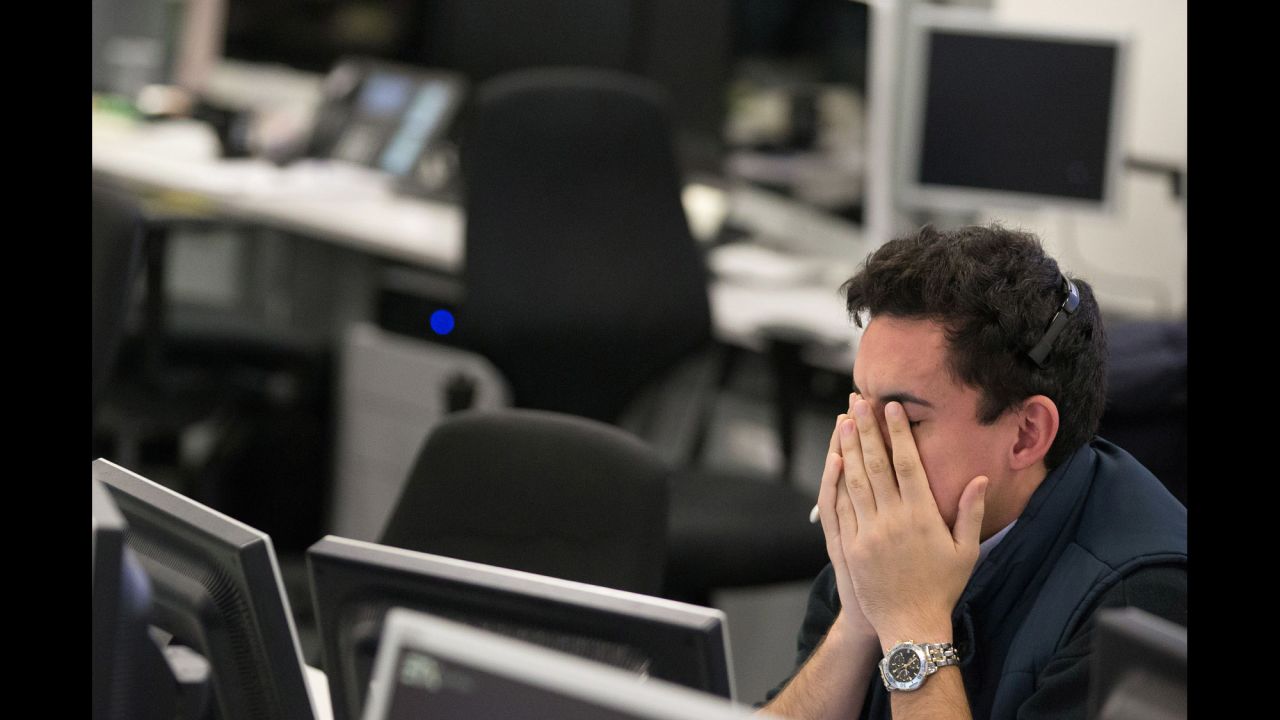 A trader from ETX Capital reacts in London following the election result.