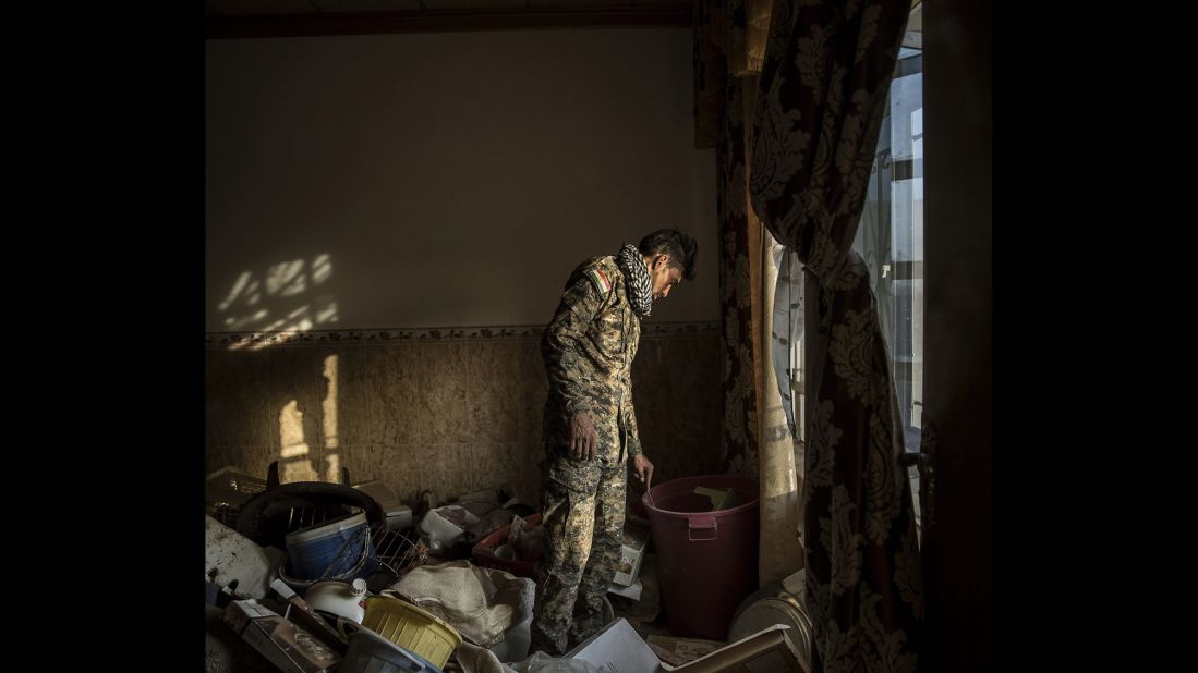 Kurdish Peshmerga forces inspect an abandoned house on the outskirts of Mosul, Iraq, in October. Kurdish forces are part of the Iraqi-led coalition to reclaim Mosul, Iraq's second-largest city, from the ISIS militant group.