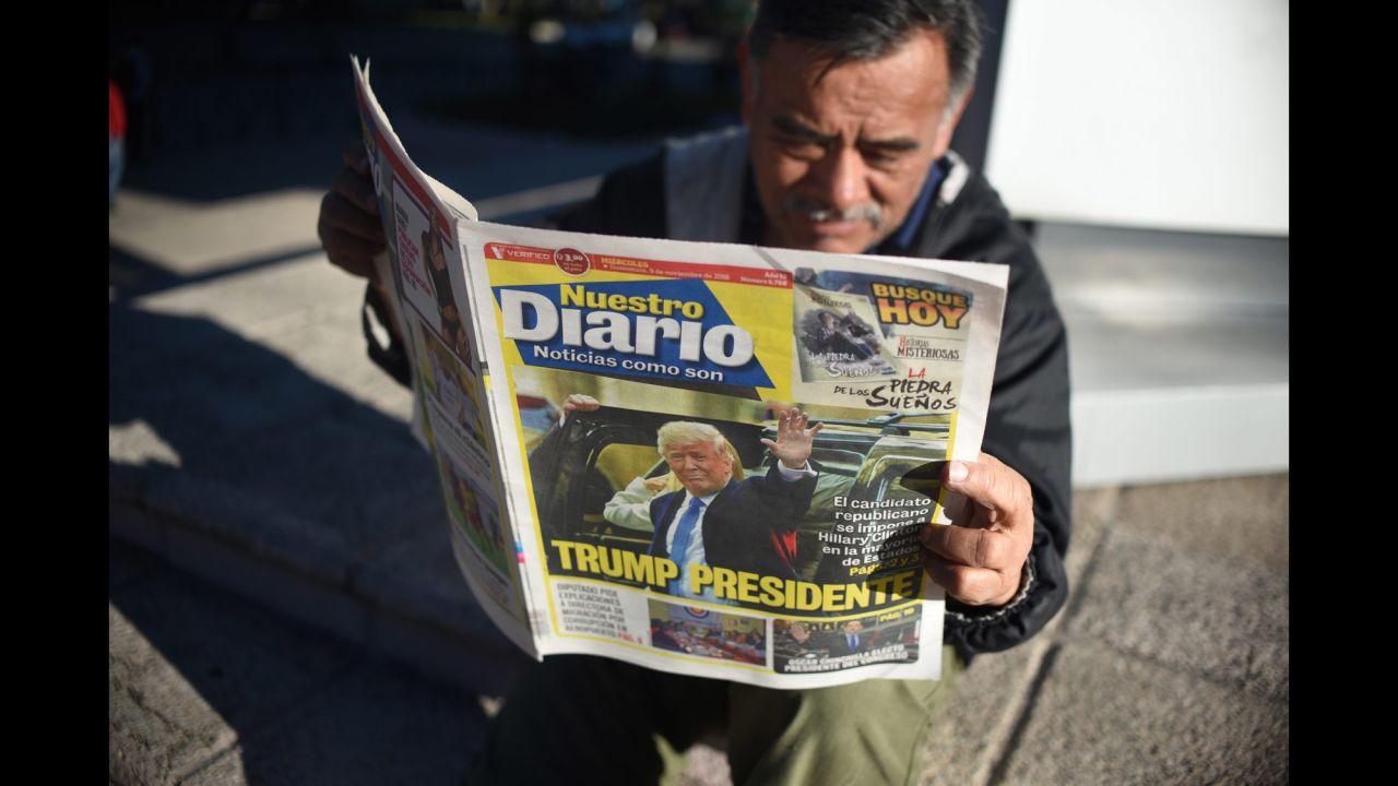 A man reads a newspaper proclaiming Trump's victory in Guatemala City, Guatemala, on November 9.