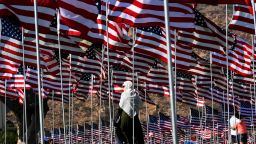 A woman wearing a hijab stands amongst US national flags erected by students and staff from Pepperdine University as they pay their respects to honor the victims of the September 11, 2001 attacks in New York, at their campus in Malibu, California on September 10, 2016. 
The students placed aound 3,000 flags in the ground in tribute to the nearly 3,000 victims lost in the attacks almost 15 years ago.  / AFP / Mark RALSTON        (Photo credit should read MARK RALSTON/AFP/Getty Images)