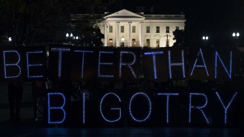 Protesters from the group Avaaz display a "Better Than Bigotry" sign outside the White House.