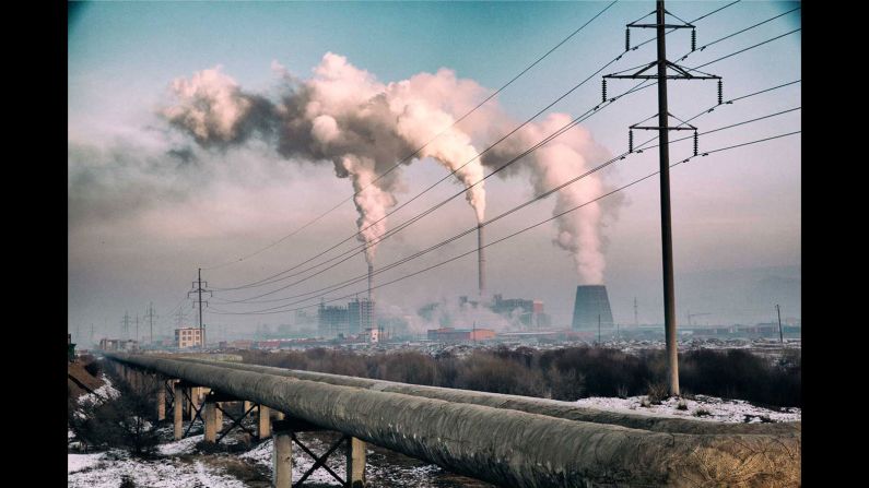 "Here, a power station heats water and circulates warmth to the city -- like some massive radiator center heating system.  At -20 degrees Celsius, water needs warming in order to circulate. The pollution is evident, and a stark contrast to the clean environment that is widely seen outside of the city."