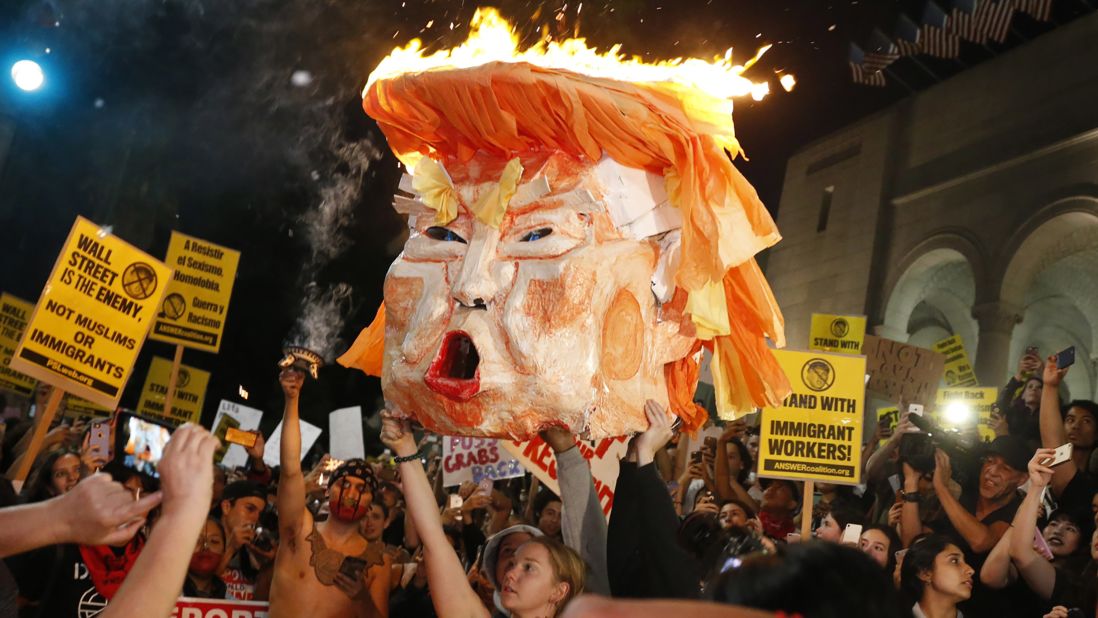 Protesters set an effigy of Trump on fire outside Los Angeles City Hall on Wednesday, November 9.