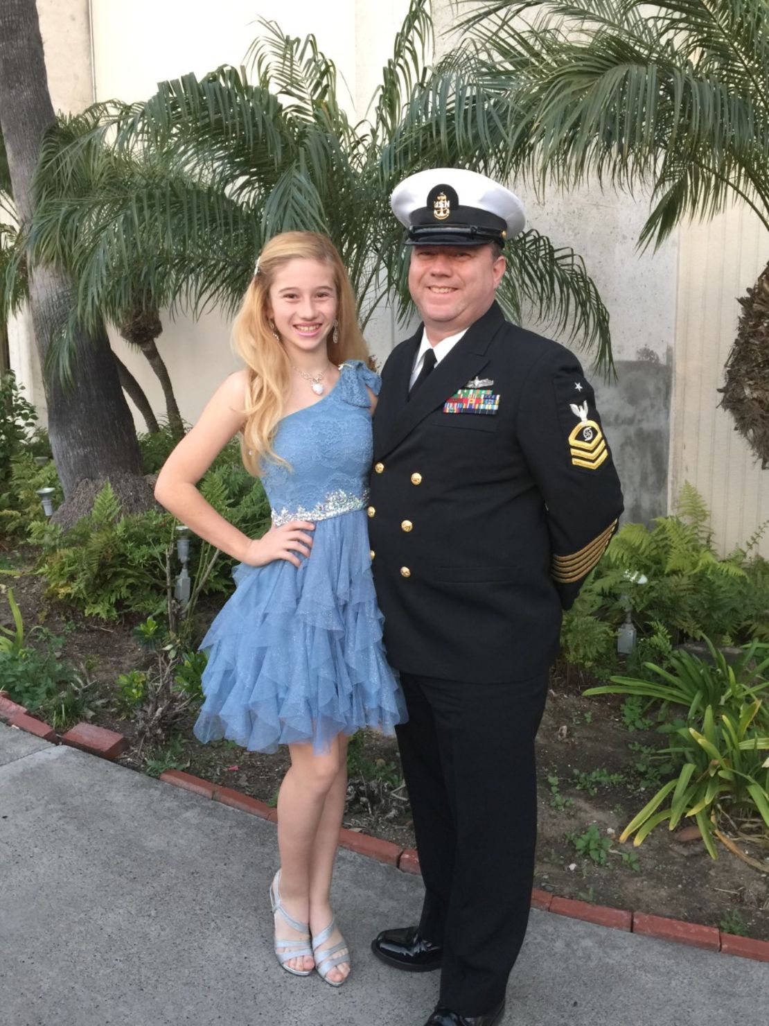 Isabelle poses with her sailor father