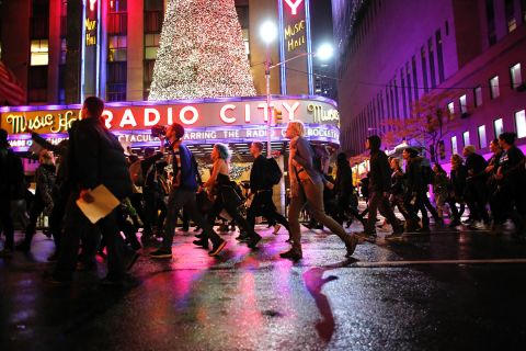 Demonstrators march past Radio City Music Hall in New York on November 9.