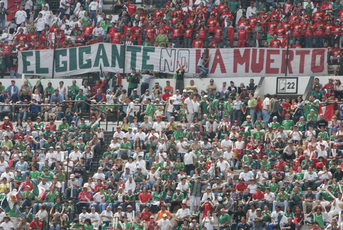Mexico fans with a banner reading "the giant is not dead" during a 2005 World Cup qualifier. 