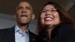US President Barack Obama (L) stands with Congresswoman Tammy Duckworth, D-IL, (R) during a Coordinated Victory Fund Event in Chicago, Illinois, October 9, 2016. / AFP / JIM WATSON        (Photo credit should read JIM WATSON/AFP/Getty Images)