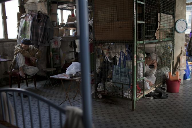 Tam Wing Dik and Leung Shu lived in their cage dwellings, in this room, for 20 years in Hong Kong's Kowloon district.