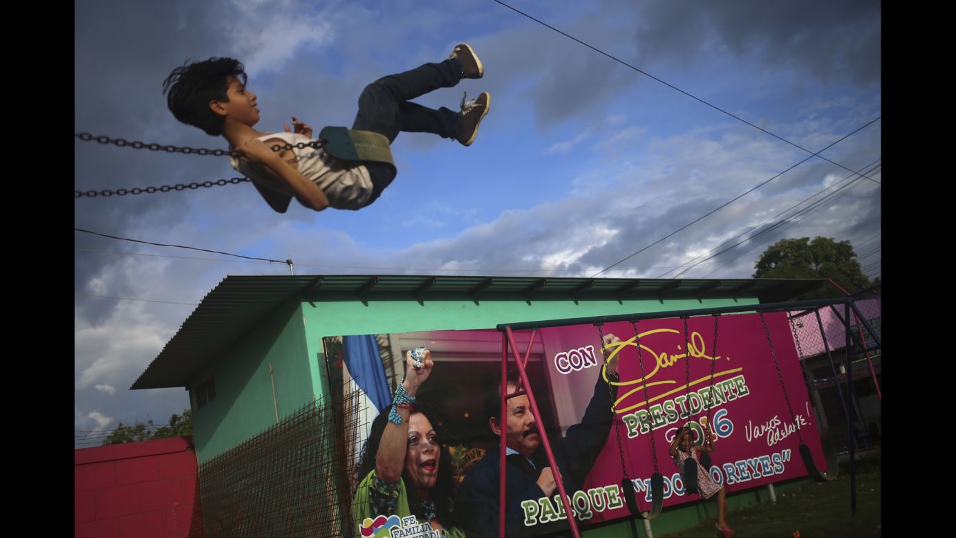 Children swing near an election billboard promoting Nicaragua's President Daniel Ortega and his wife, Rosario Murillo, in Managua, Nicaragua, on Friday, November 4. <a href="http://www.cnn.com/2016/11/06/americas/nicaragua-presidential-election/" target="_blank">Ortega clinched a fourth term victory</a> that day, but this time with his wife as his running mate. 