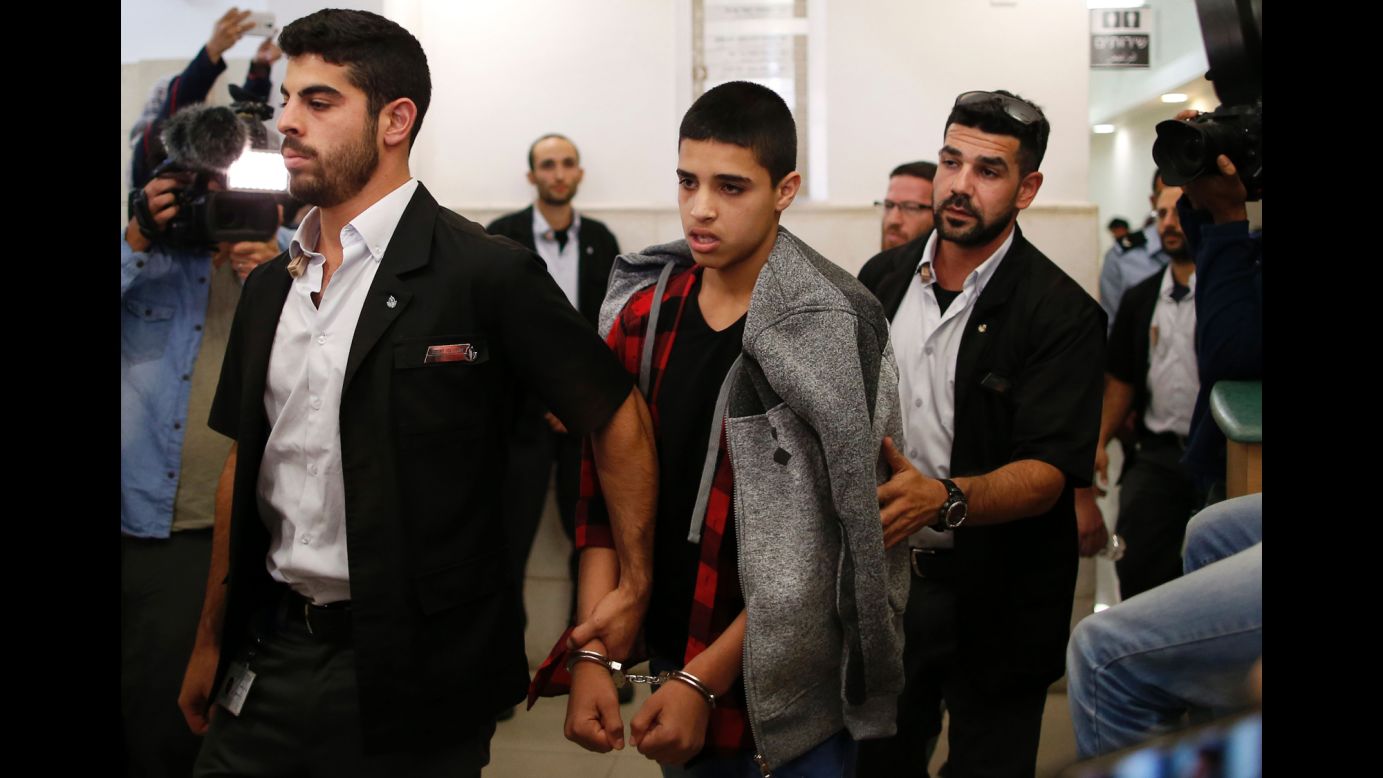 Ahmed Manasra, center, leaves a court in Jerusalem on Monday, November 7. The 14-year-old Palestinian boy was sentenced to 12 years in prison for carrying out a stabbing attack that wounded two Israelis in October last year, <a href="http://www.reuters.com/article/us-israel-palestinians-sentence-idUSKBN1321XK?il=0" target="_blank" target="_blank">according to Reuters</a>. 