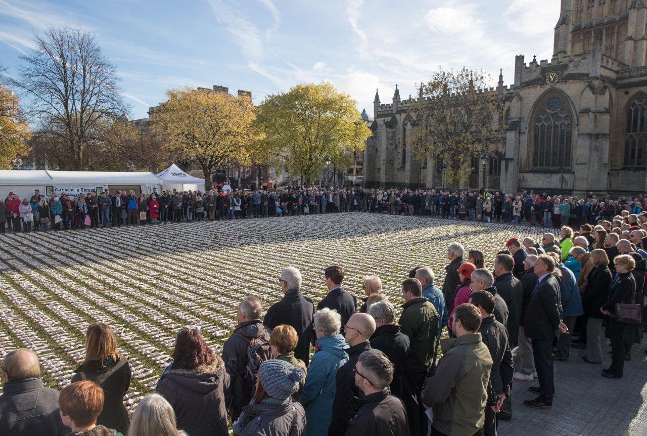 People gather around 19,420 figurines that were laid out in Bristol, England, as part of Rob Heard's Shrouds of the Somme art installation on November 11. A memorial service was held beside the artwork, which features one figurine for every British soldier who died on the first day of World War I's Battle of the Somme.