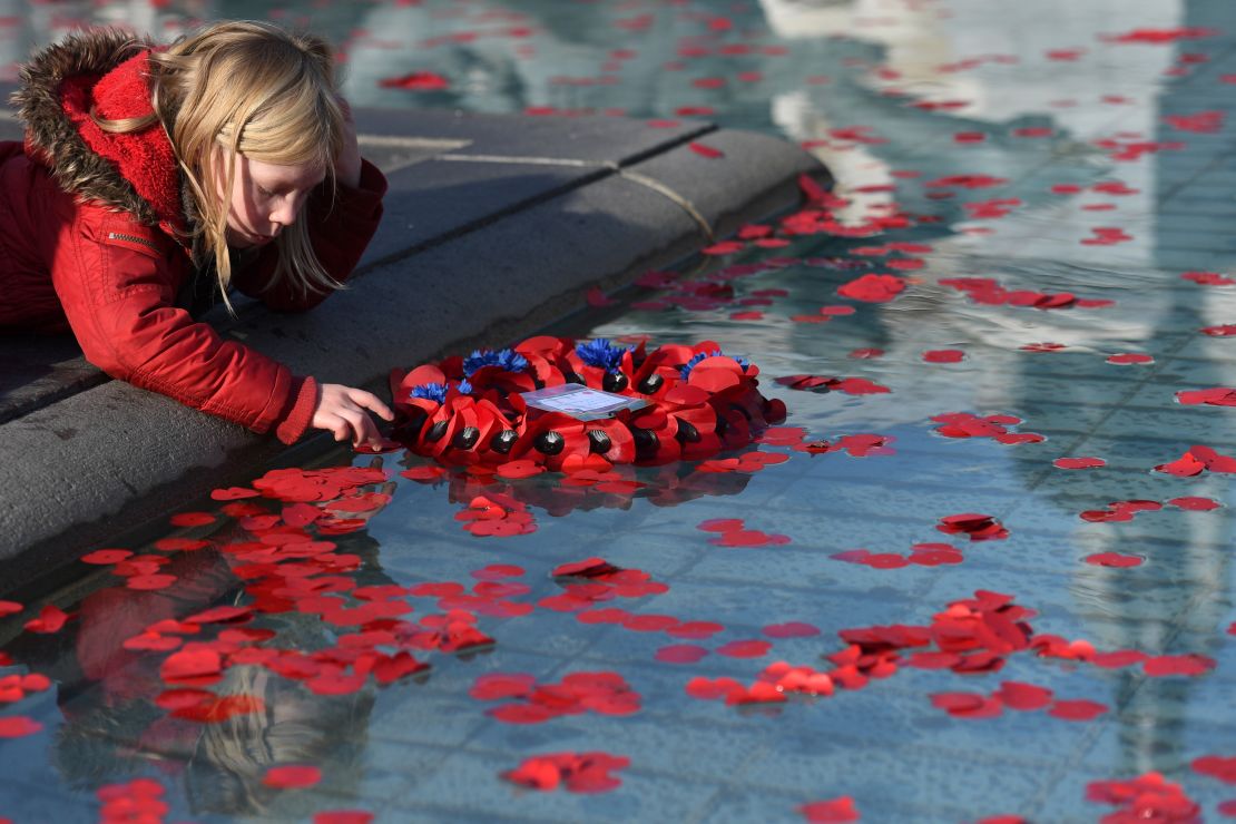 Members of the public were invited to place poppies in the fountains at Trafalgar Square. 