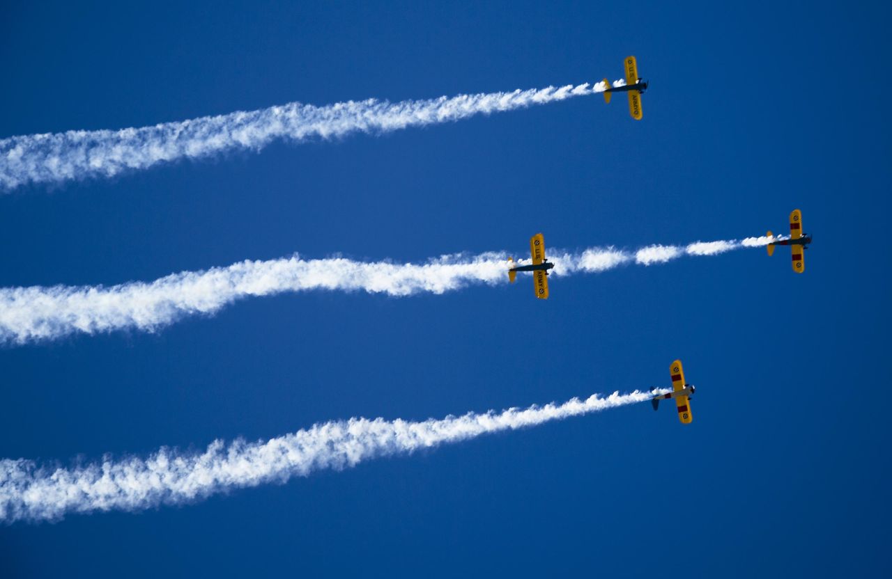 Planes fly over Central Avenue in Phoenix at the start of the Veterans Day Parade on November 11. 