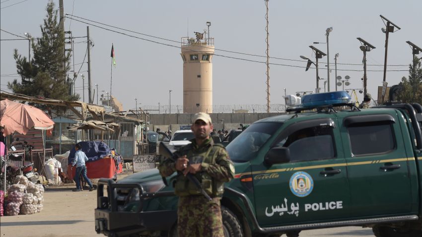 An Afghan security personnel keeps watch near the largest US military base in Bagram after an explosion on November 12. Four people were killed in an explosion inside the largest US military base in Afghanistan, NATO said, with local officials blaming a suicide attacker posing as a labourer for the major security breach.