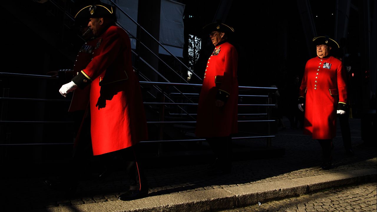 Chelsea Pensioners walk past the Lloyd's building following two minutes of silence for Remembrance Day on November 11 in London, England.