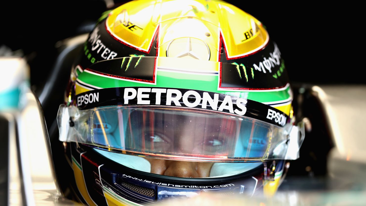 Lewis Hamilton beat his rival Nico Rosberg to pole position in Brazil by a tenth of a second.