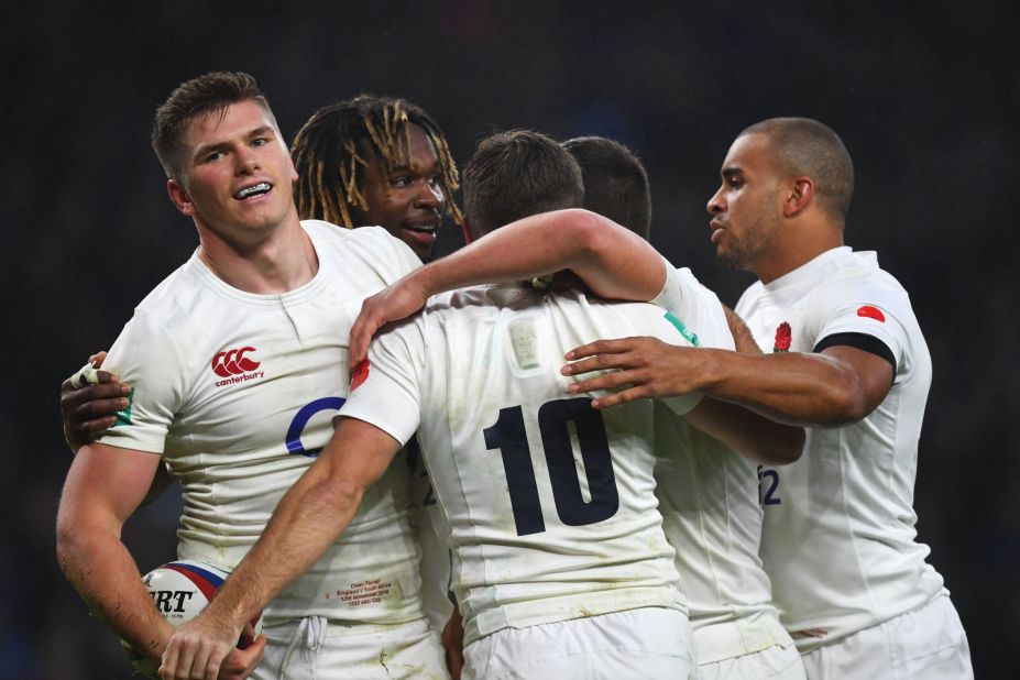 Owen Farrell (far left) celebrates scoring his team's fourth try during the first England win over South Africa in a decade.