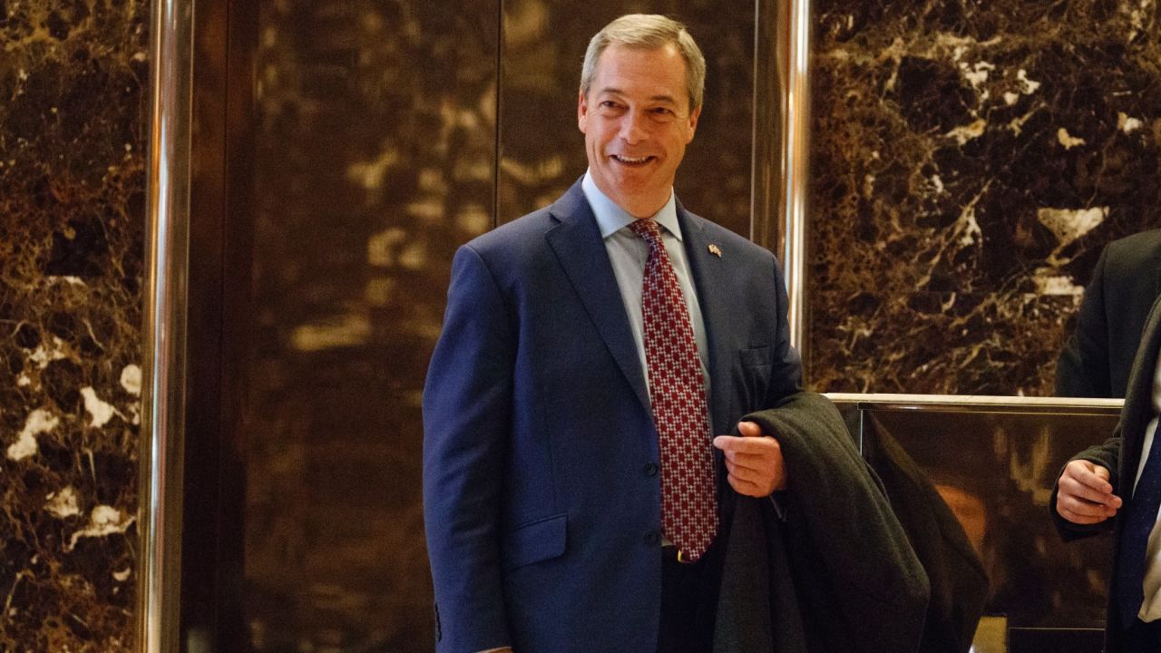 U.K. Independence Party leader Nigel Farage smiles as he arrives at Trump Tower, Saturday, Nov. 12, 2016, in New York. 