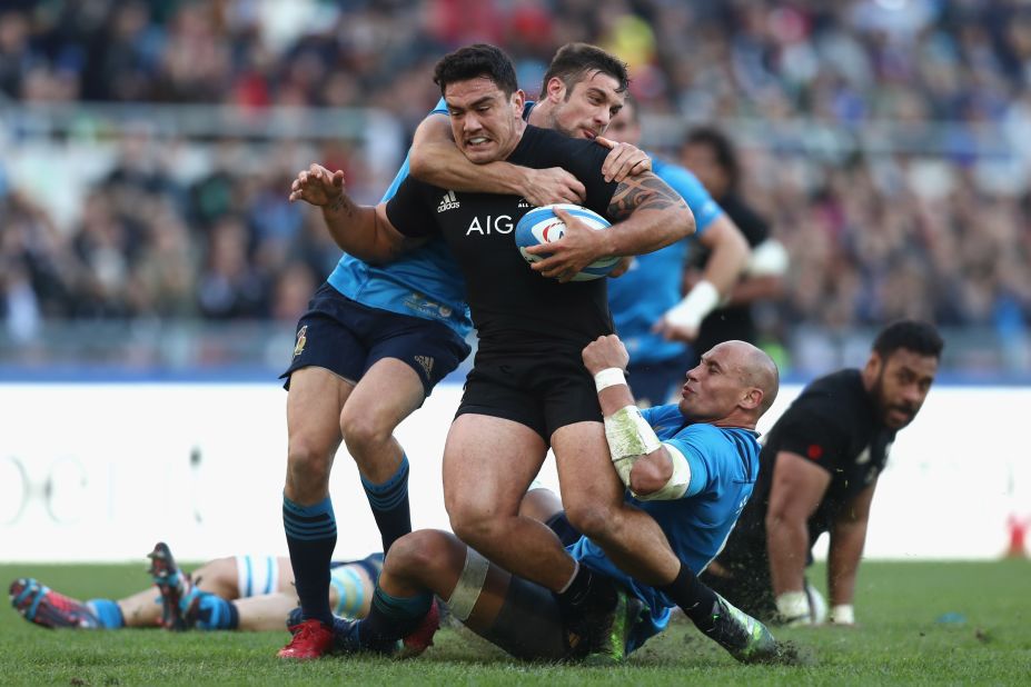 It takes two to bring down Codie Taylor of the New Zealand All Blacks.