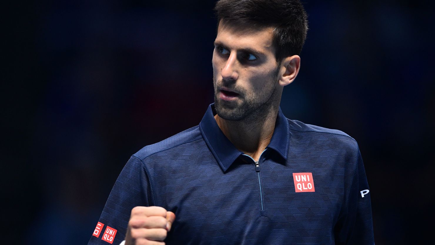 Serbia's Novak Djokovic celebrates a point against Austria's Dominic Thiem on his way to victory in his ATP World Tour Finals opener.