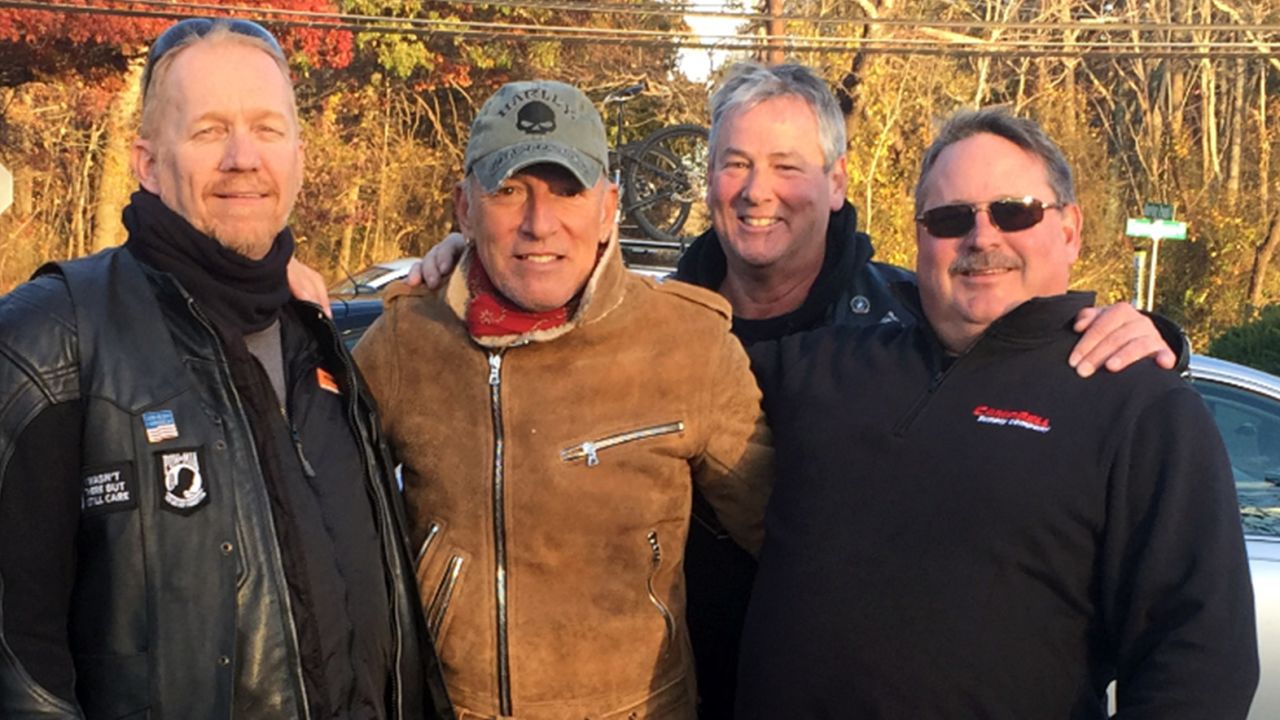 Bob Grigs, Dan Barkalow and Ryan Bailey (from left) of the Freehold American Legion - Monmouth Post 54 pose with Bruce Springsteen. 
