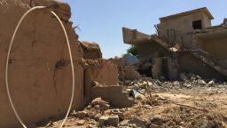 In this handout image provided by Human Rights Watch, destroyed houses are seen in Qarah Tappah, Iraq, with partial red X still visible, May 20, 2016. Human Rights Watch is accusing the security forces of Iraq's regional Kurdish government of destroying Arab homes and even some villages in areas retaken from the Islamic State group. The report says that between September 2014 and May 2016, forces advancing against IS destroyed Arab homes in disputed areas of Kirkuk and Nineveh governorates, while Kurdish homes were left intact. (Human Rights Watch via AP)