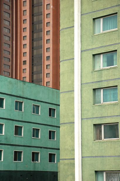 Many buildings in Pyongyang have been painted pasted colors to reduce the blandness of raw concrete.