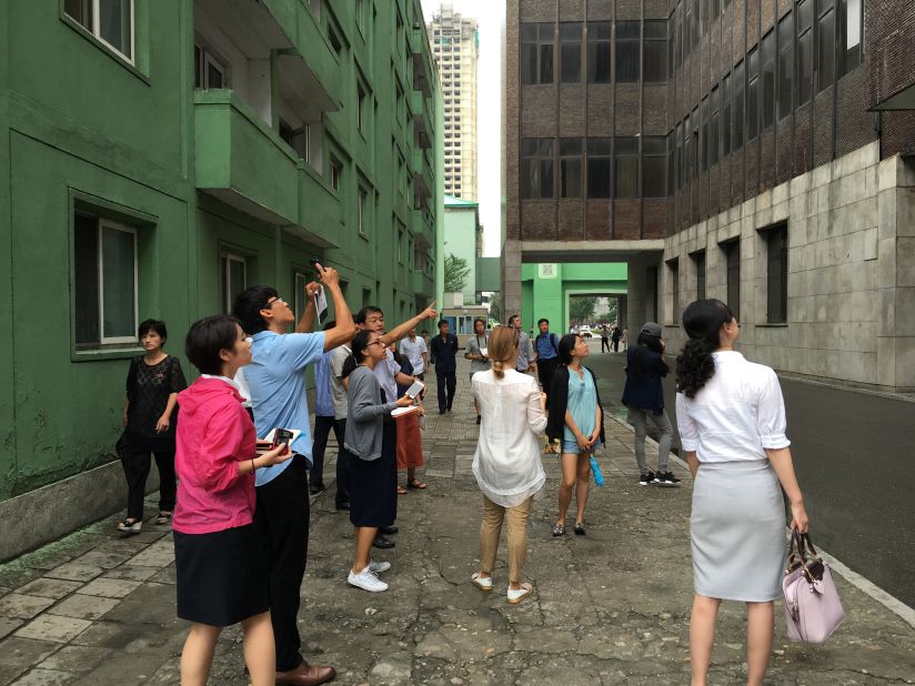 A group of international and local North Korean architecture students analyzing a project site during the AA Visiting School workshop in August 2016.