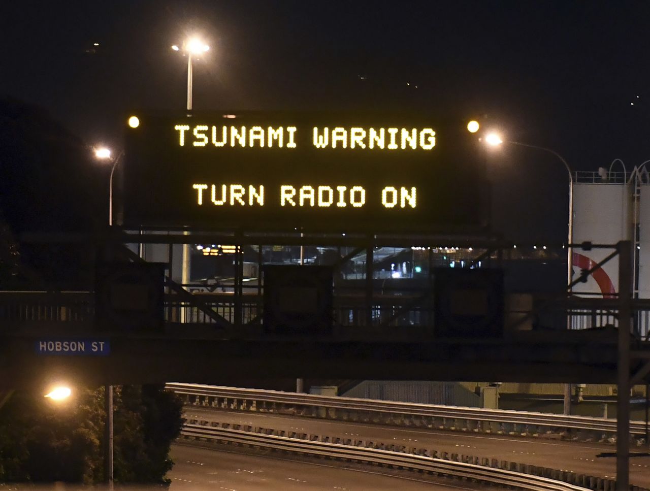 A road sign flashes a tsunami warning in Wellington on November 14. Waves of just over two meters high hit the coast following the earthquake.