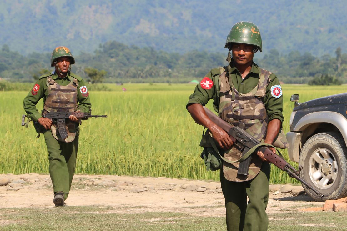 In this photograph taken on October 21, 2016, armed Myanmar army soldiers patrol a village in Maungdaw located in Rakhine State