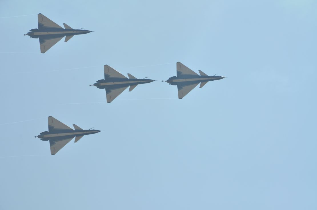 J-10 fighters from China's August 1st aerobatics team perform at Airshow China in Zhuhai on November 4, 2016. The show was Capt. Yu Xu's last public performance.