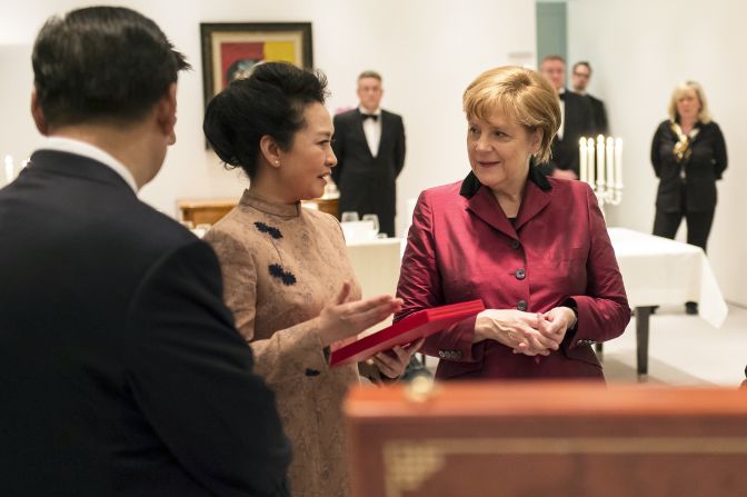 German Chancellor Angela Merkel speaks with Chinese President Xi Jinping and his wife Peng Liyuan. "You know sometimes clothing can come across aggressive when it's too revealing and eye-catching and it's the opposite of traditional Chinese aesthetics," Ma told CNN.