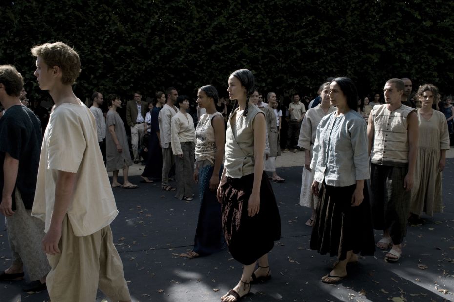 Models of wear Ma Ke's "Qingpin" collection and march gracefully in the Palais Royal during Paris Haute Couture Week, 2008.