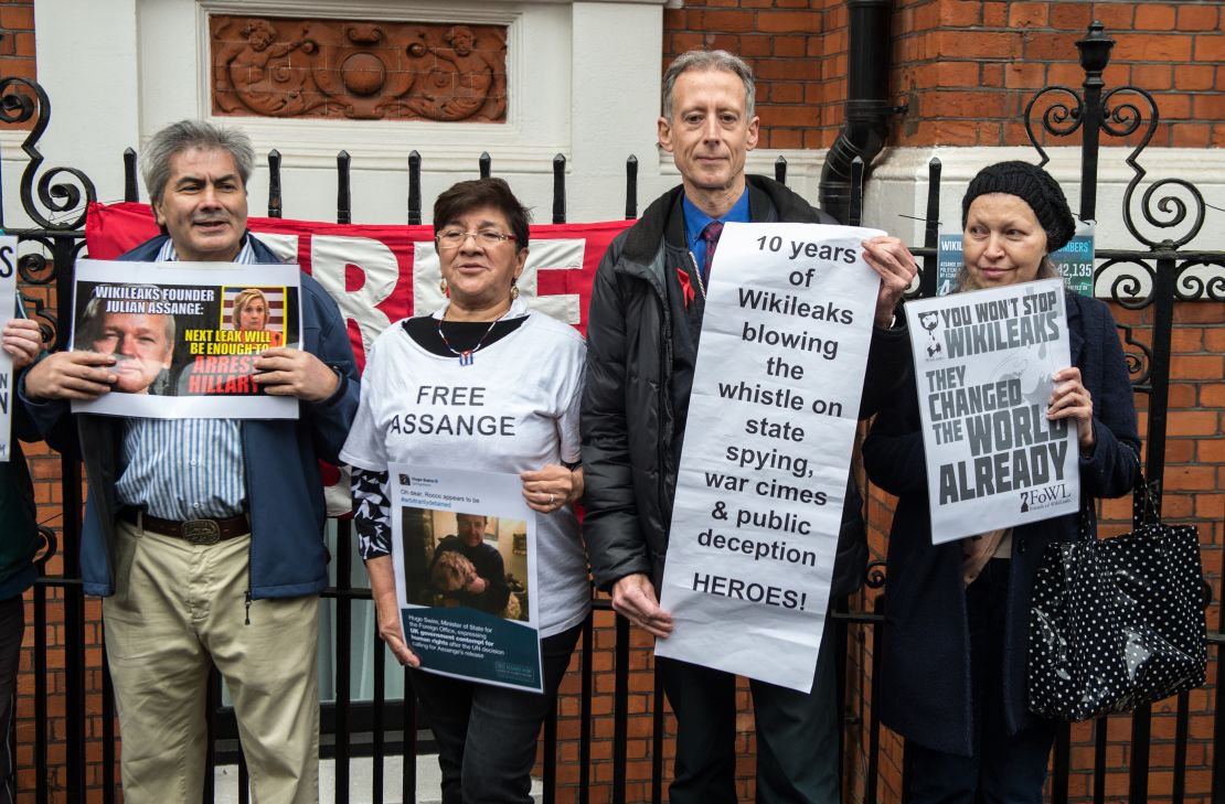 Supporters of Julian Assange gather outside Ecuador's Embassy in London Monday.
