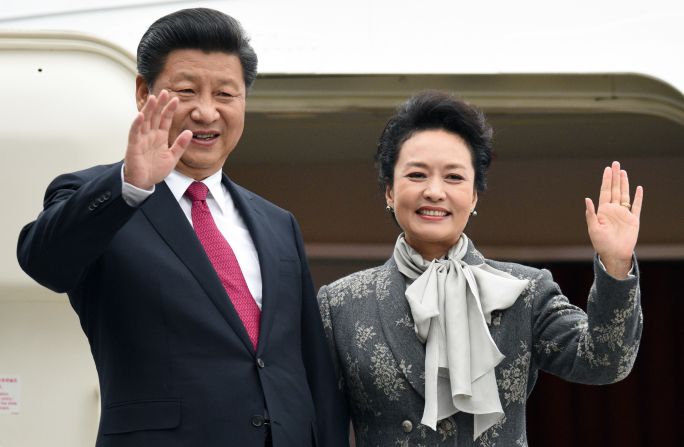 Chinese President Xi Jinping and his wife Peng Liyuan. "Like the traditional Chinese ink painting, the blank space between fabric and skin is where the beauty resides," designer Ma Ke says. 