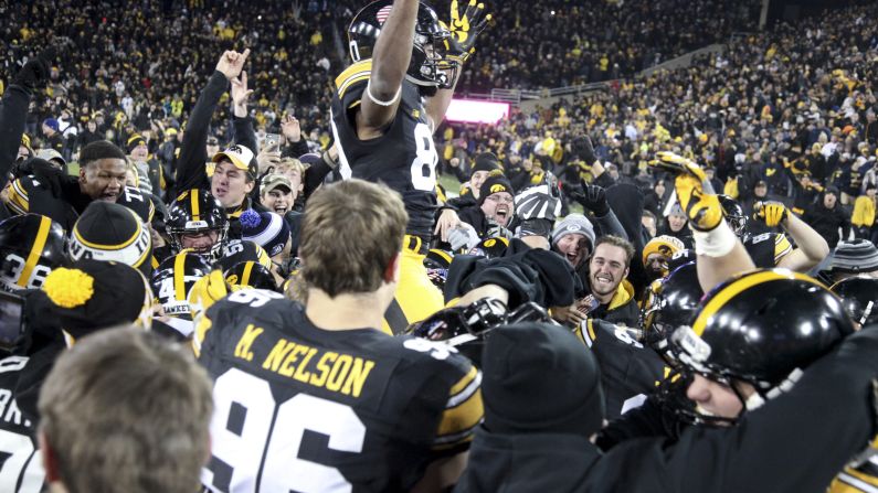 The Iowa Hawkeyes celebrate after their 14-13 win over No. 3 Michigan on Saturday, November 12. Keith Duncan kicked a 33-yard field goal as time expired to hand Michigan its first loss of the season. No. 2 Clemson and No. 4 Washington also lost, leaving Alabama and Western Michigan as the only undefeated teams in the top tier of college football.