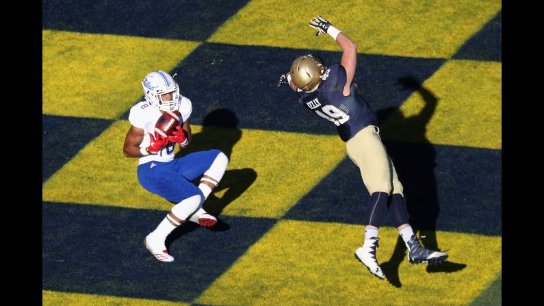 Tulsa's Keenen Johnson catches a second-half touchdown pass at Navy on Saturday, November 12. Navy won a 42-40 shootout.