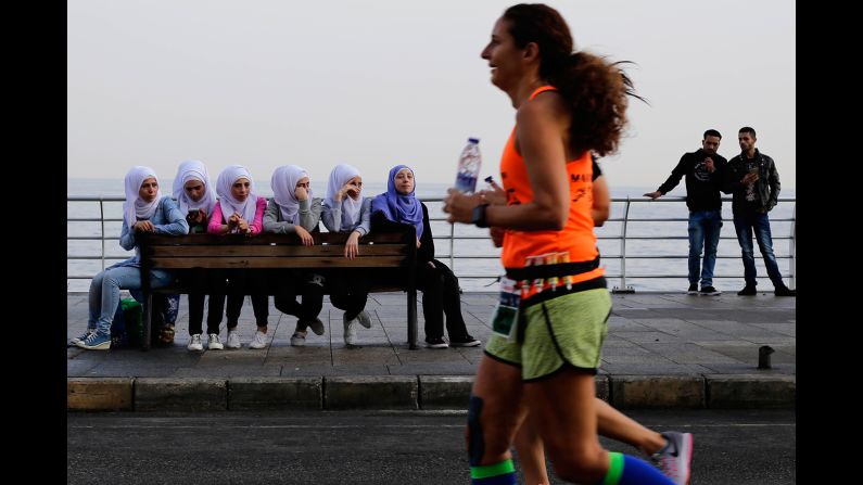 People in Beirut, Lebanon, watch runners compete in the Beirut Marathon on Sunday, November 13.