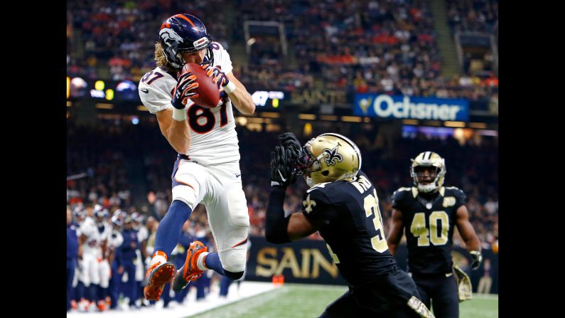 Denver wide receiver Jordan Taylor pulls in a touchdown pass in front of New Orleans safety Jairus Byrd during an NFL game on Sunday, November 13. Denver won 25-23 after returning a blocked extra point.