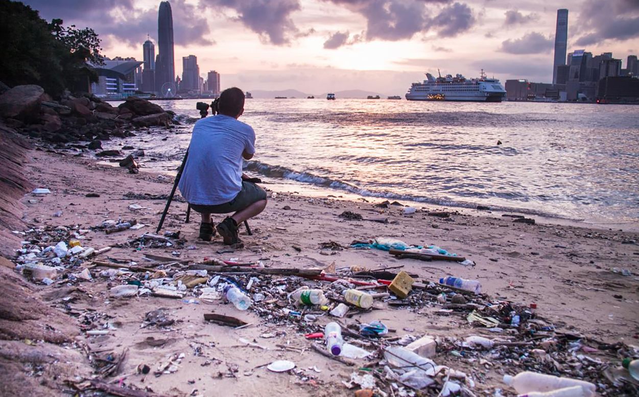 Photo: Ryan Lai, Hong Kong: "Piles of solid waste lie behind a perfectly-framed photograph of spectacular scenery." 
